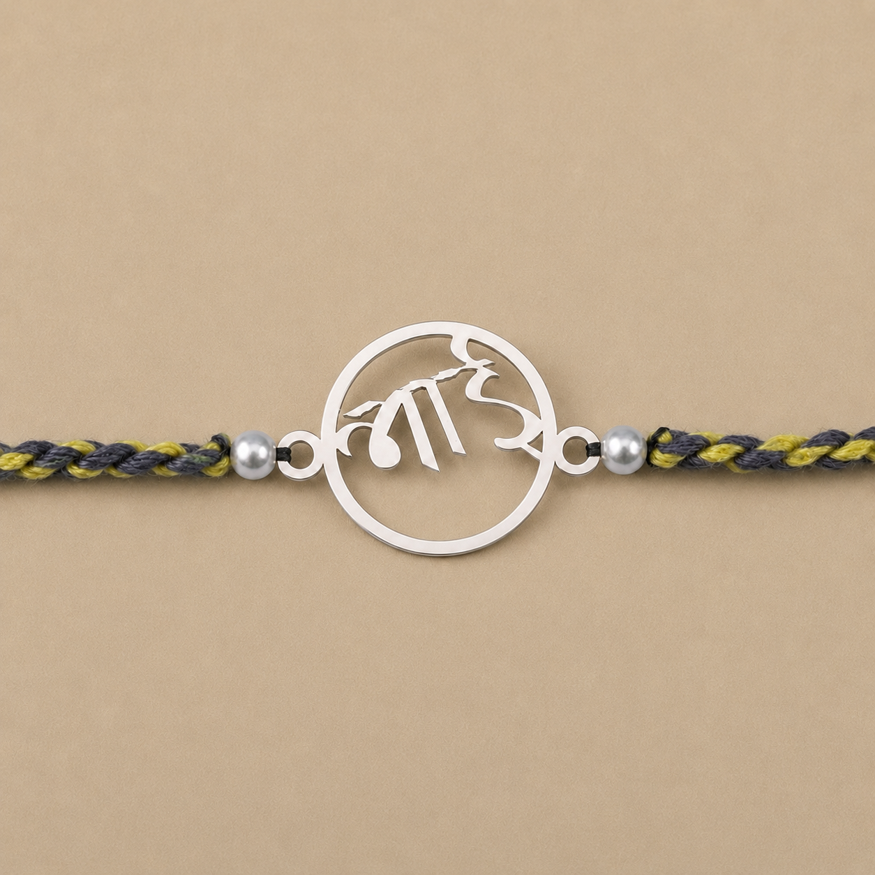 Close up view of 925 sterling silver circular ring charm with Hindi Bhai script and pearl beads