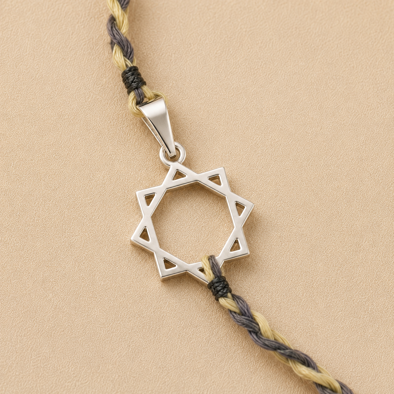 Close up view of 8 pointed geometric star charm crafted in pure 925 sterling silver
