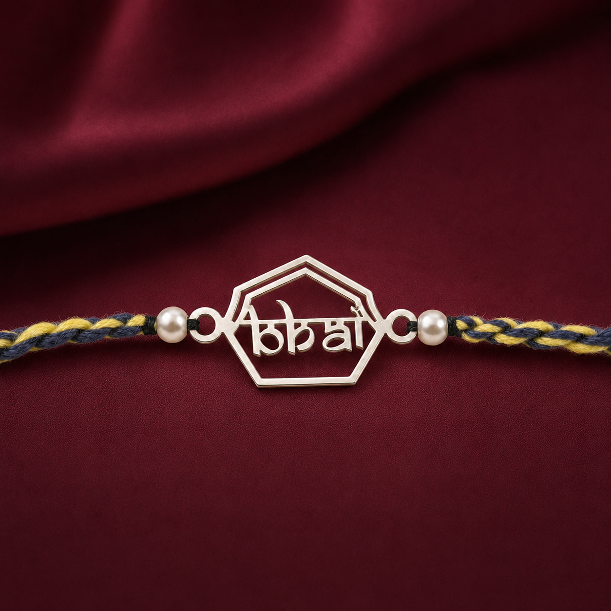 Close up view of 925 sterling silver hexagonal frame charm with Hindi Bhai inscription