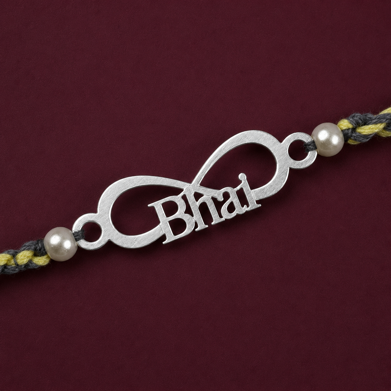 Close up view of 925 sterling silver infinity loop charm with Bhai script and pearl beads