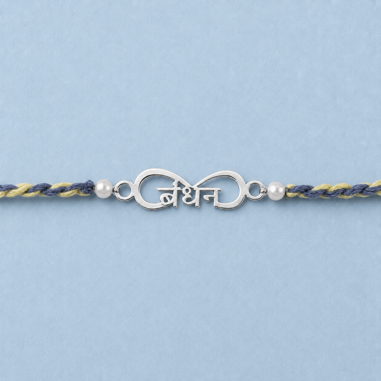 Close up view of 925 sterling silver infinity charm inscribed and pearl beads