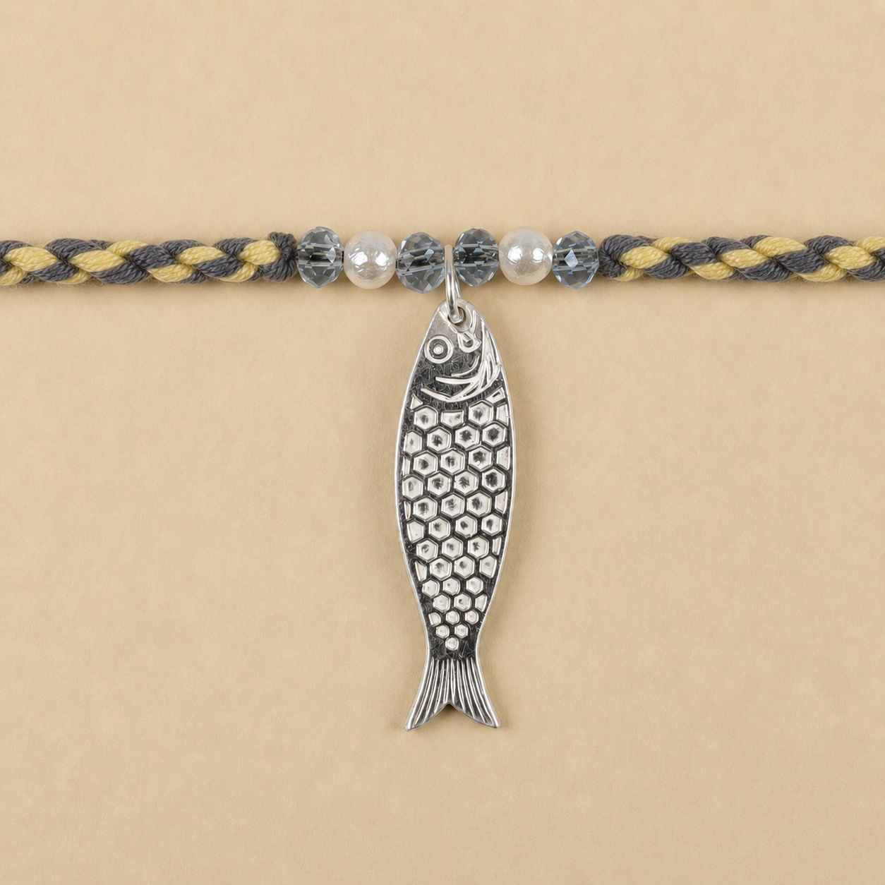 Close up view of textured 925 sterling silver Matsya fish avatar pendant with pearl accents