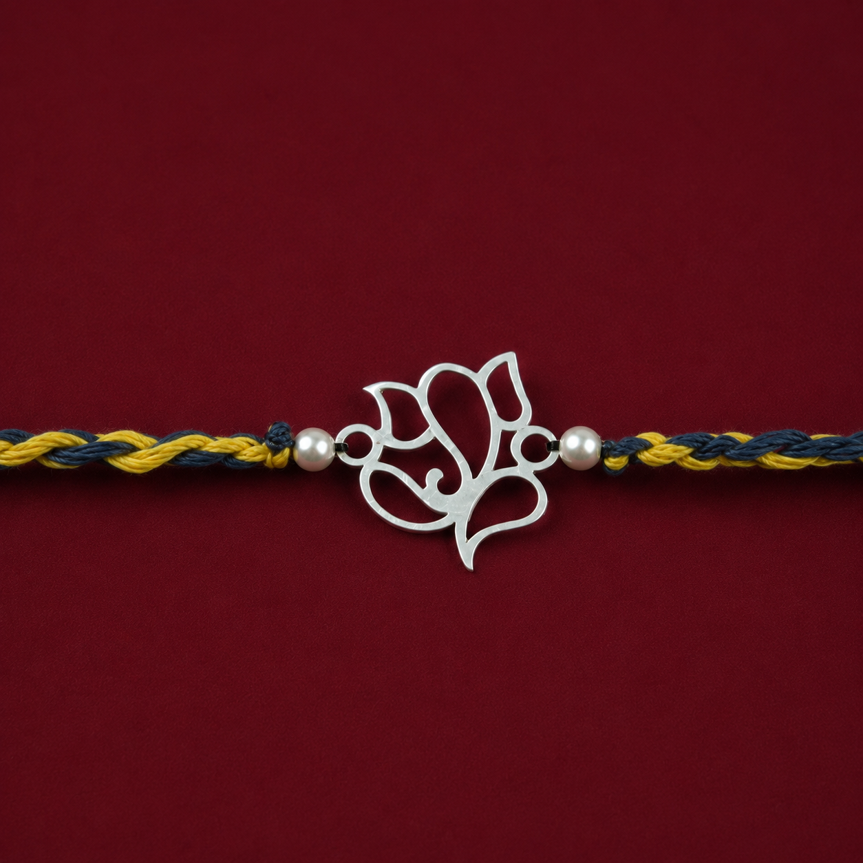 Close up view of 925 sterling silver openwork Lord Ganesha charm with silver accent beads