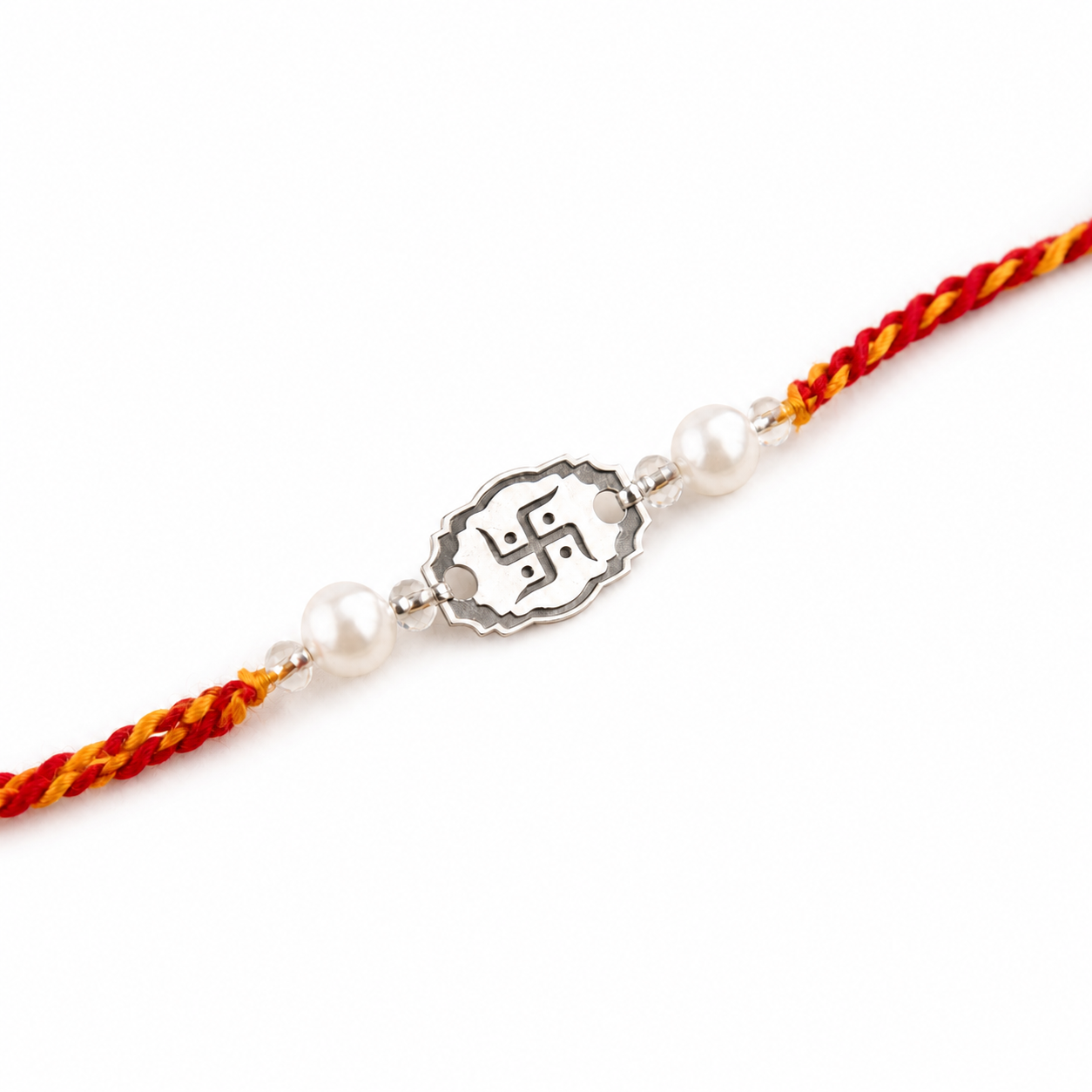 Close up view of engraved 925 sterling silver Swastika oval charm with pearl beads on red thread