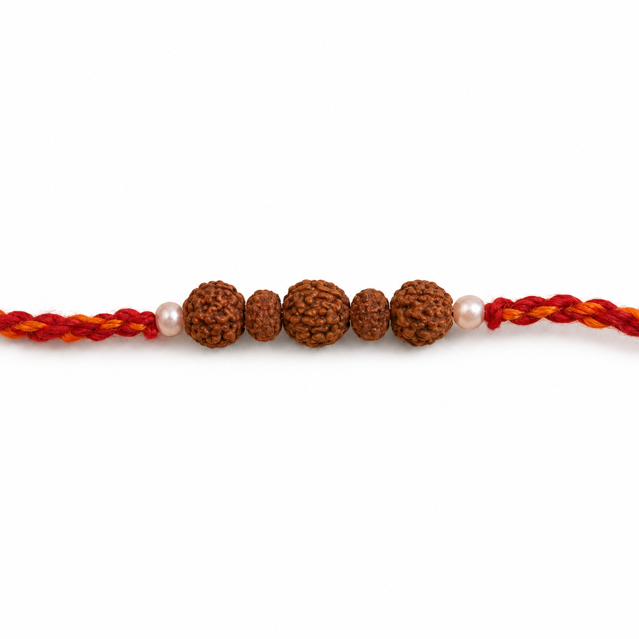 Close up view of Rudraksha beads flanked by white pearl accents on red thread