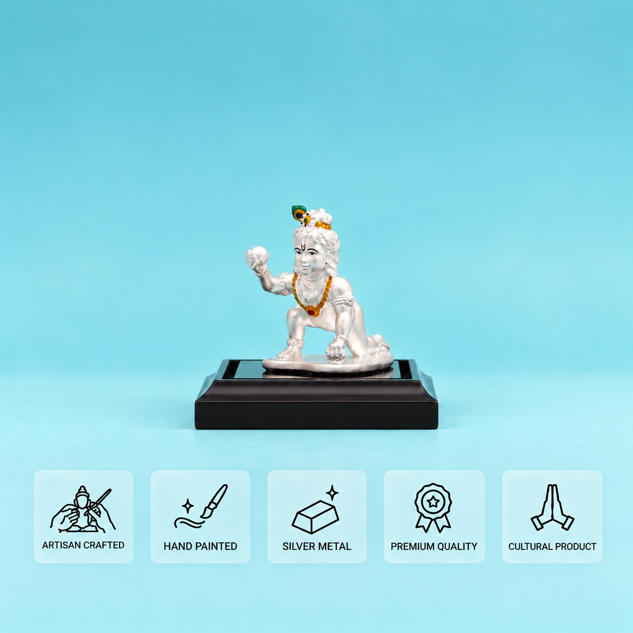 Silver crawling Laddu Gopal idol on a dark display stand with five feature cards.