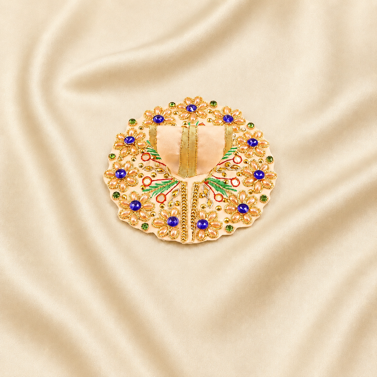 Cream Laddu Gopal dress with golden flowers and blue stone detailing.
