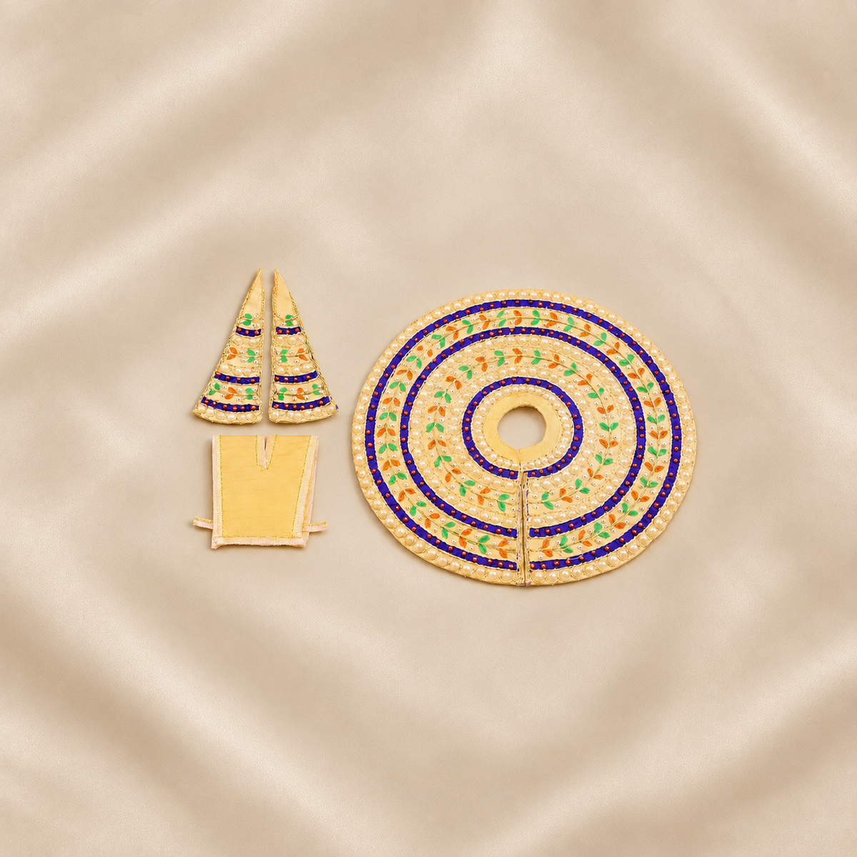 Cream Laddu Gopal dress set with blue bands, pearl work and matching accessories.