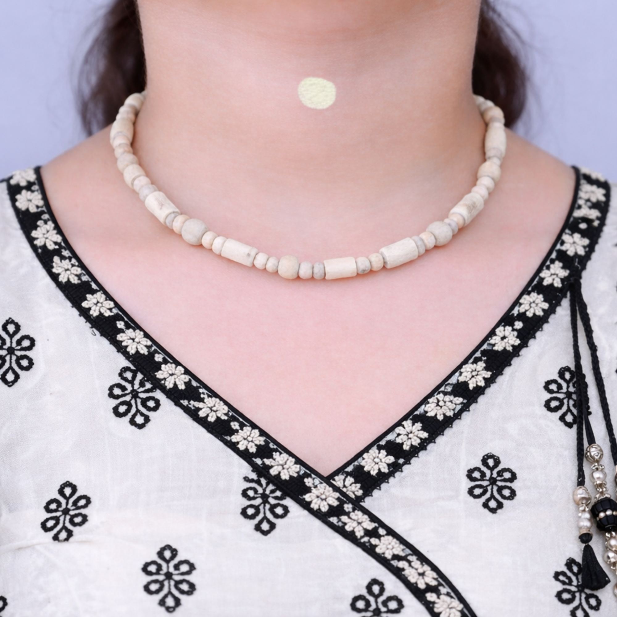 Woman wearing a premium pure Tulsi kanthi mala with fine cut cylindrical beads