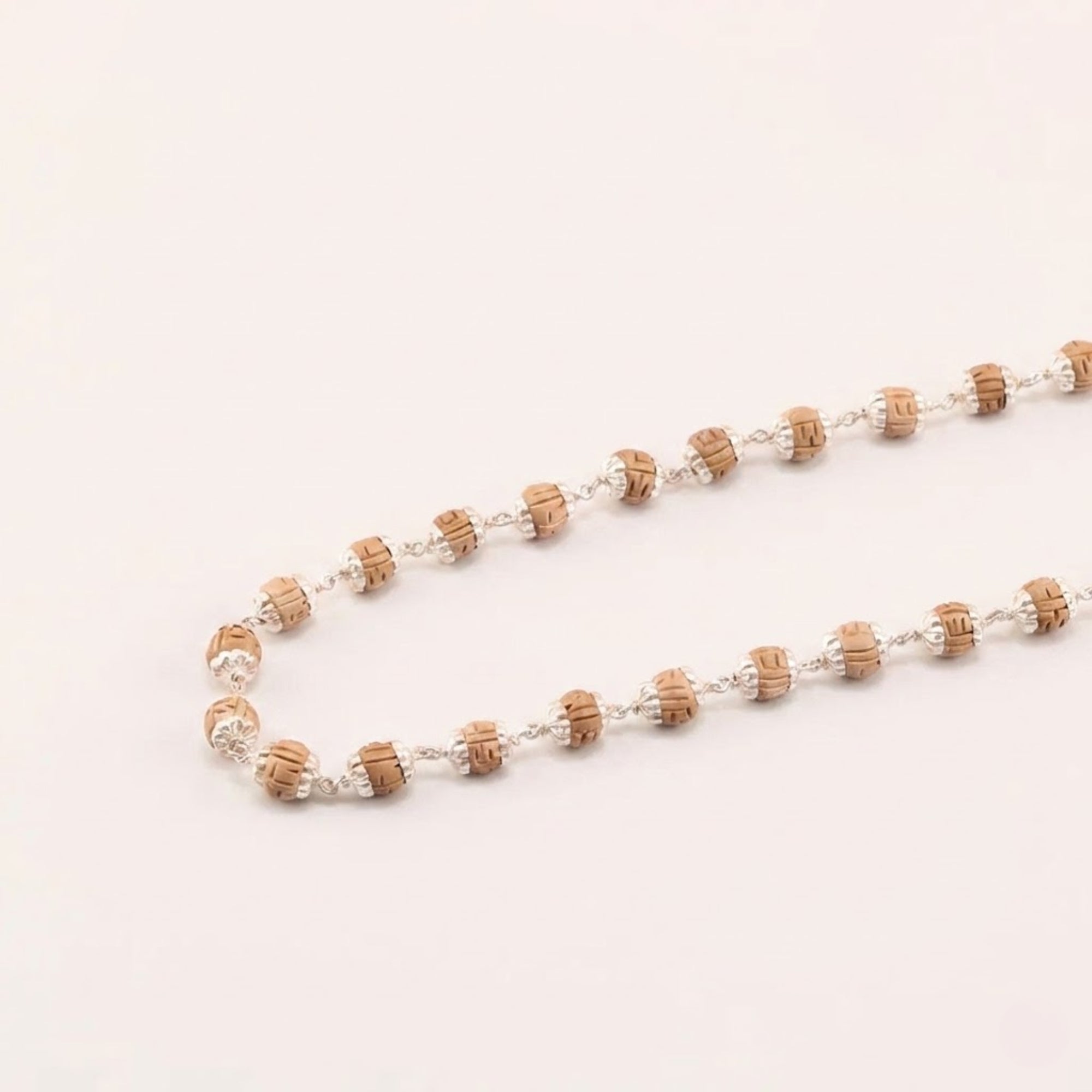 pure silver Tulsi bead necklace featuring  hand carved wood beads with silver capping