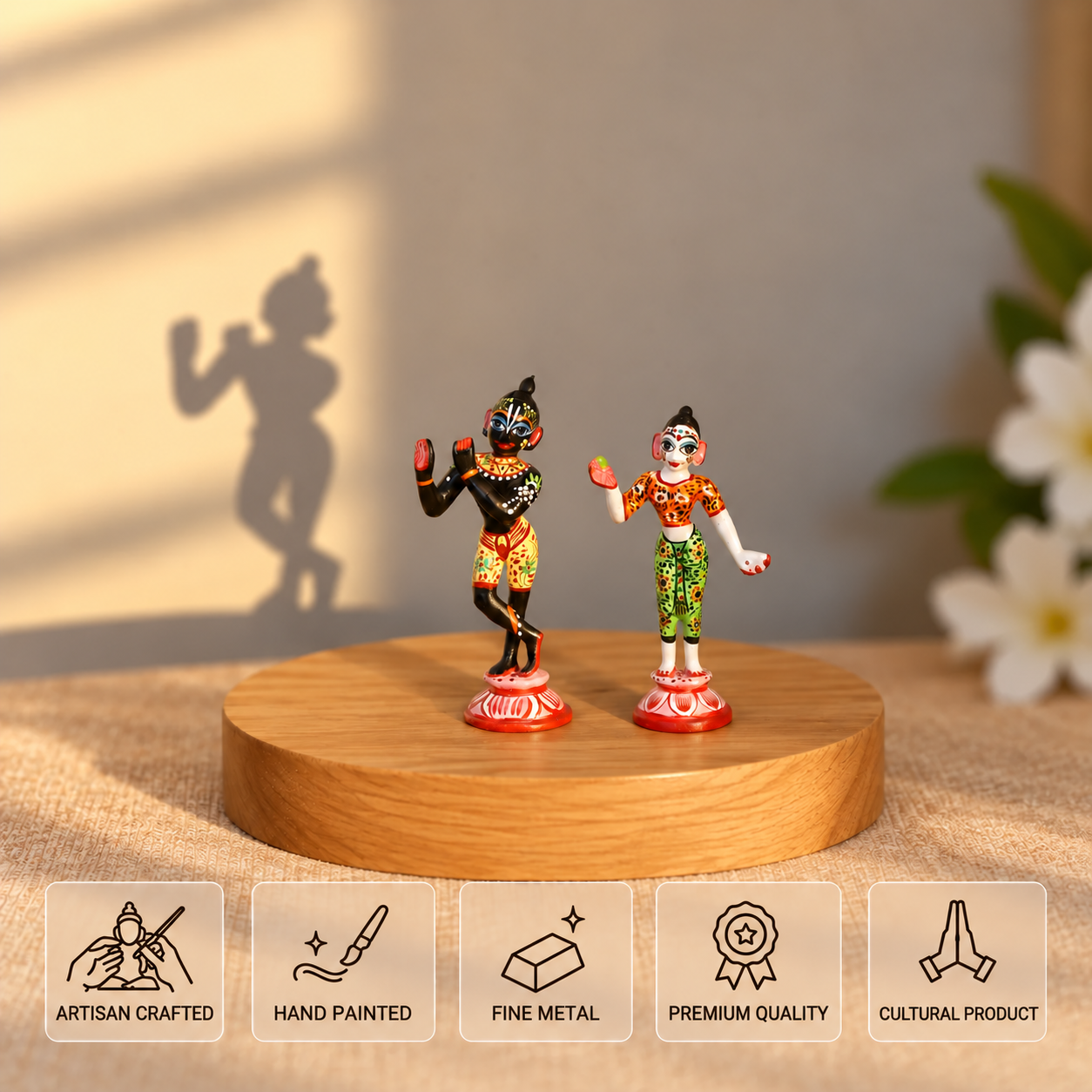 Handcrafted and hand-painted metal Radha Krishna idols standing on a round wooden base with feature highlights including Artisan Crafted, Hand Painted, Fine Metal, Premium Quality, and Cultural Product