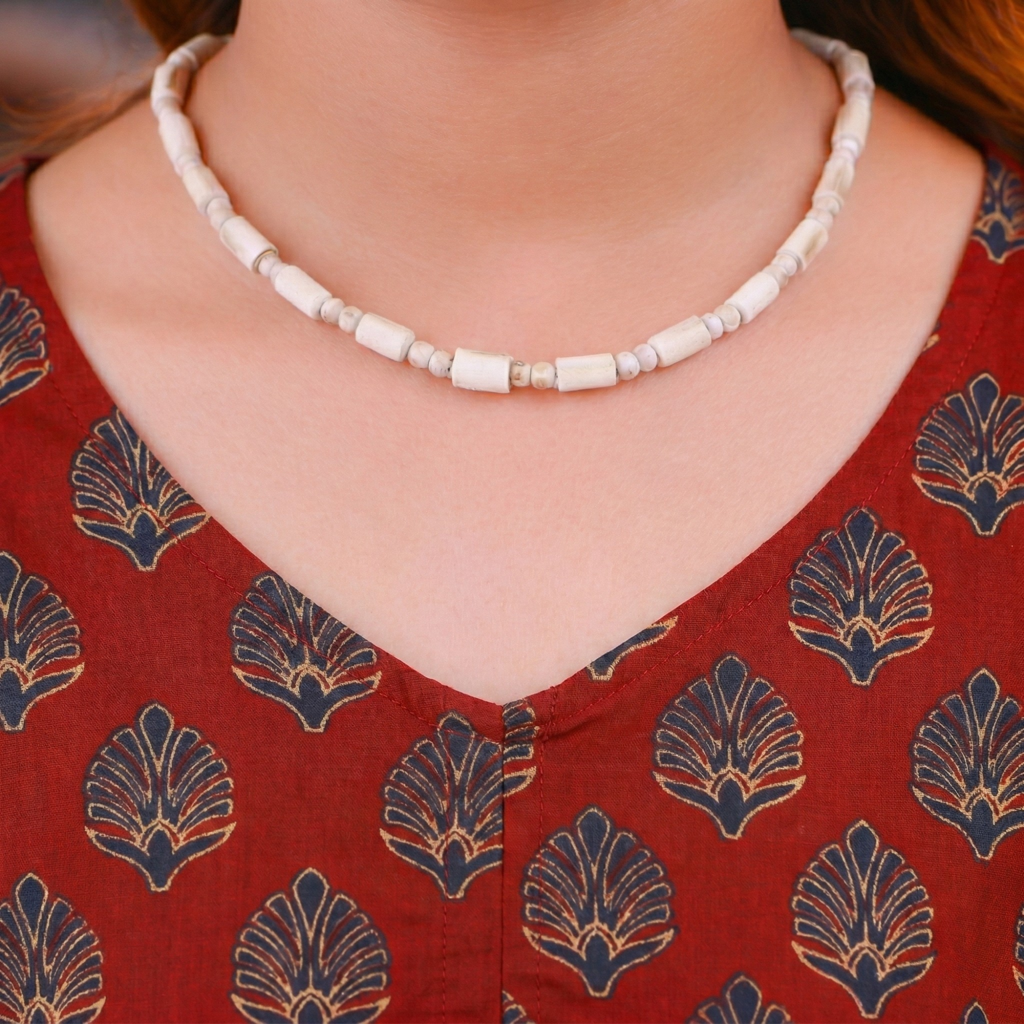Woman wearing a handcrafted Tulsi Kanthi Mala necklace featuring unique cylindrical wood beads