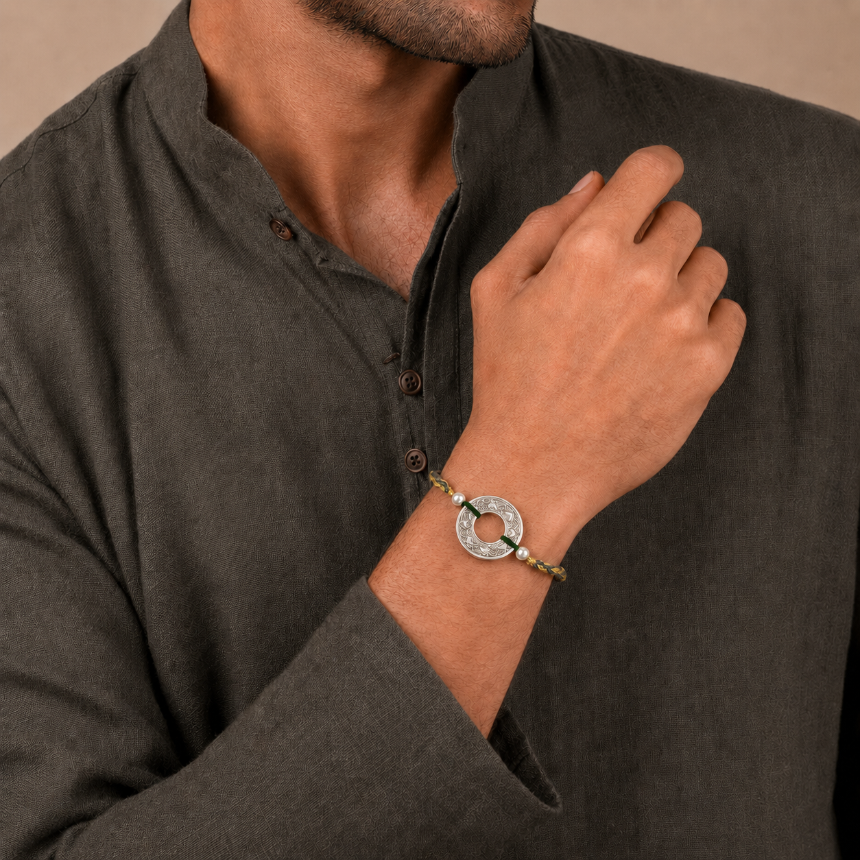 Brother wearing handcrafted 925 pure silver filigree rakhi bracelet with dark grey kurta