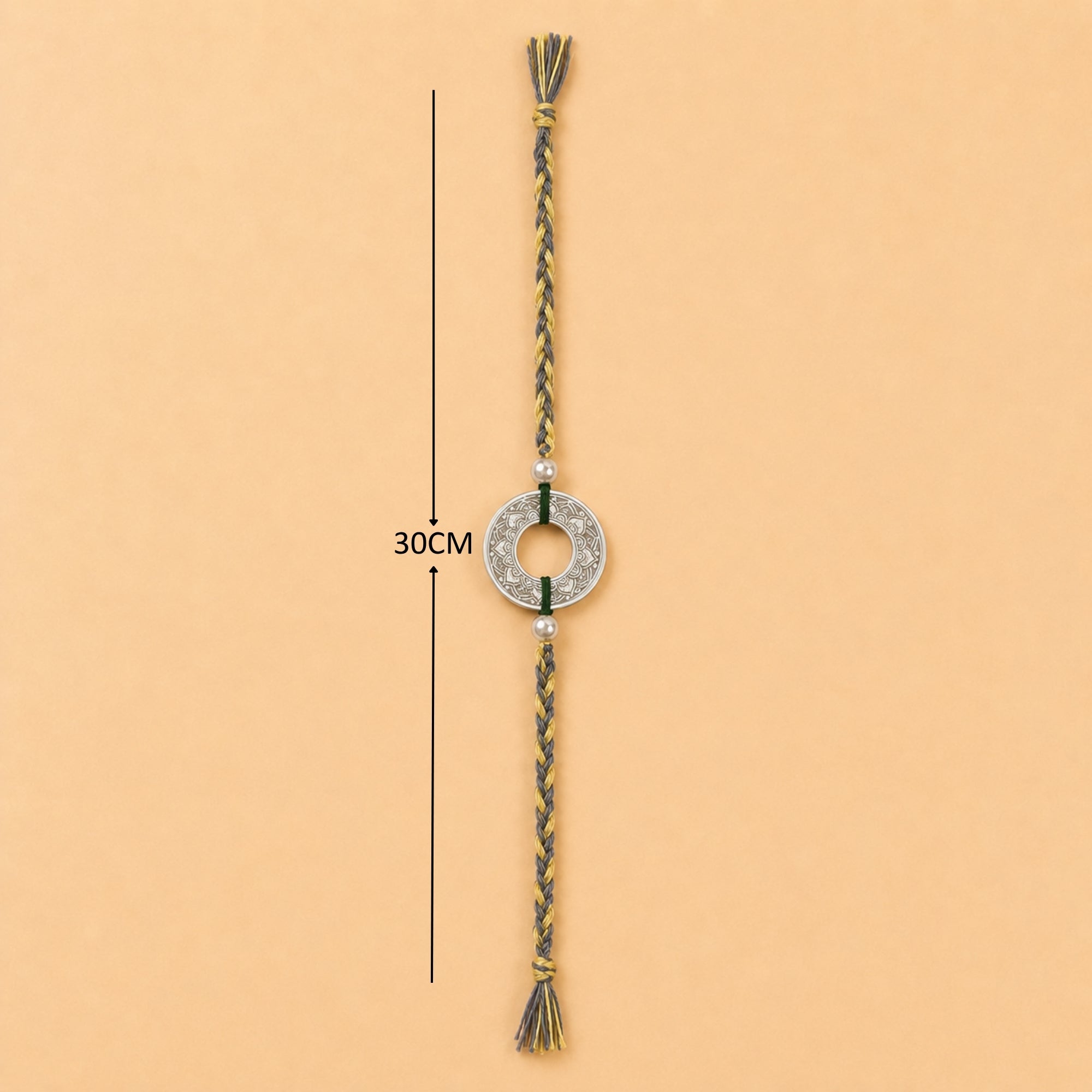 Full length layout showing thread length and tassels of handcrafted silver rakhi