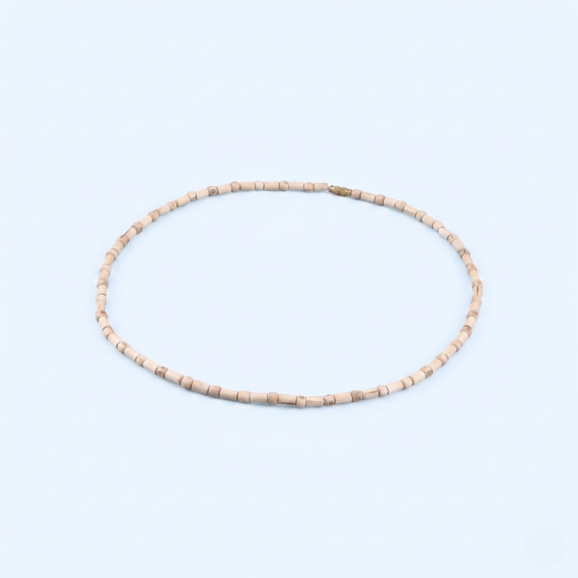 Close up of handmade cylindrical shaped wooden beads on a Tulsi kanthi mala