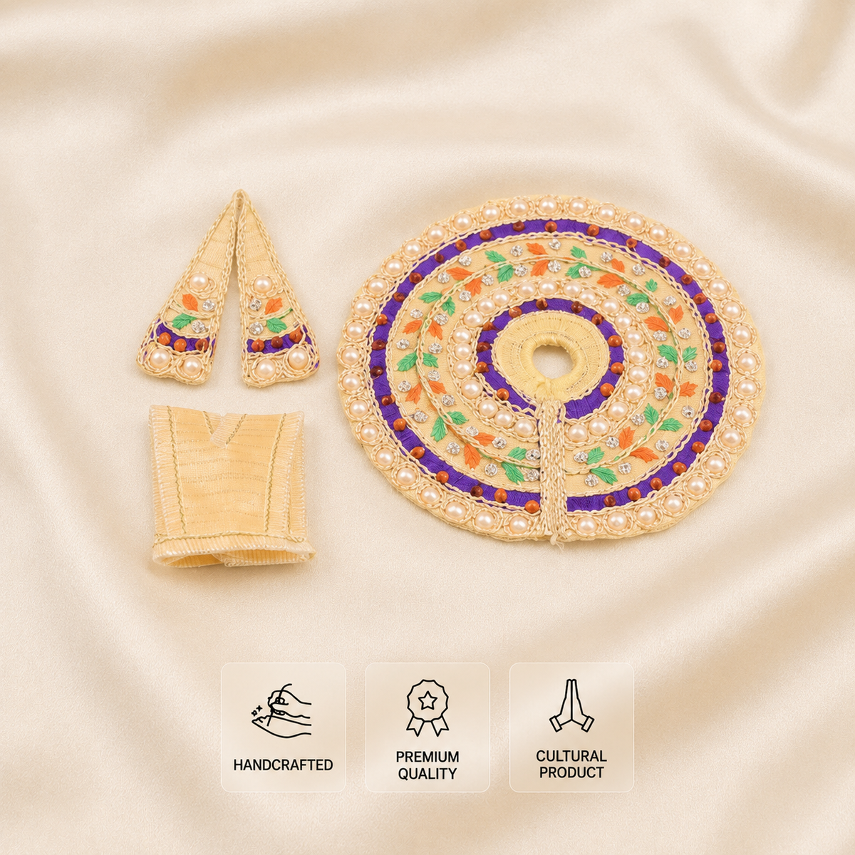 An embroidered traditional garment poshak set on a beige satin background, featuring a large circular patch, two small pointed patches, and a folded fabric piece. The embroidery is primarily gold with purple, green, and orange accents, and includes pearl-like bead details.