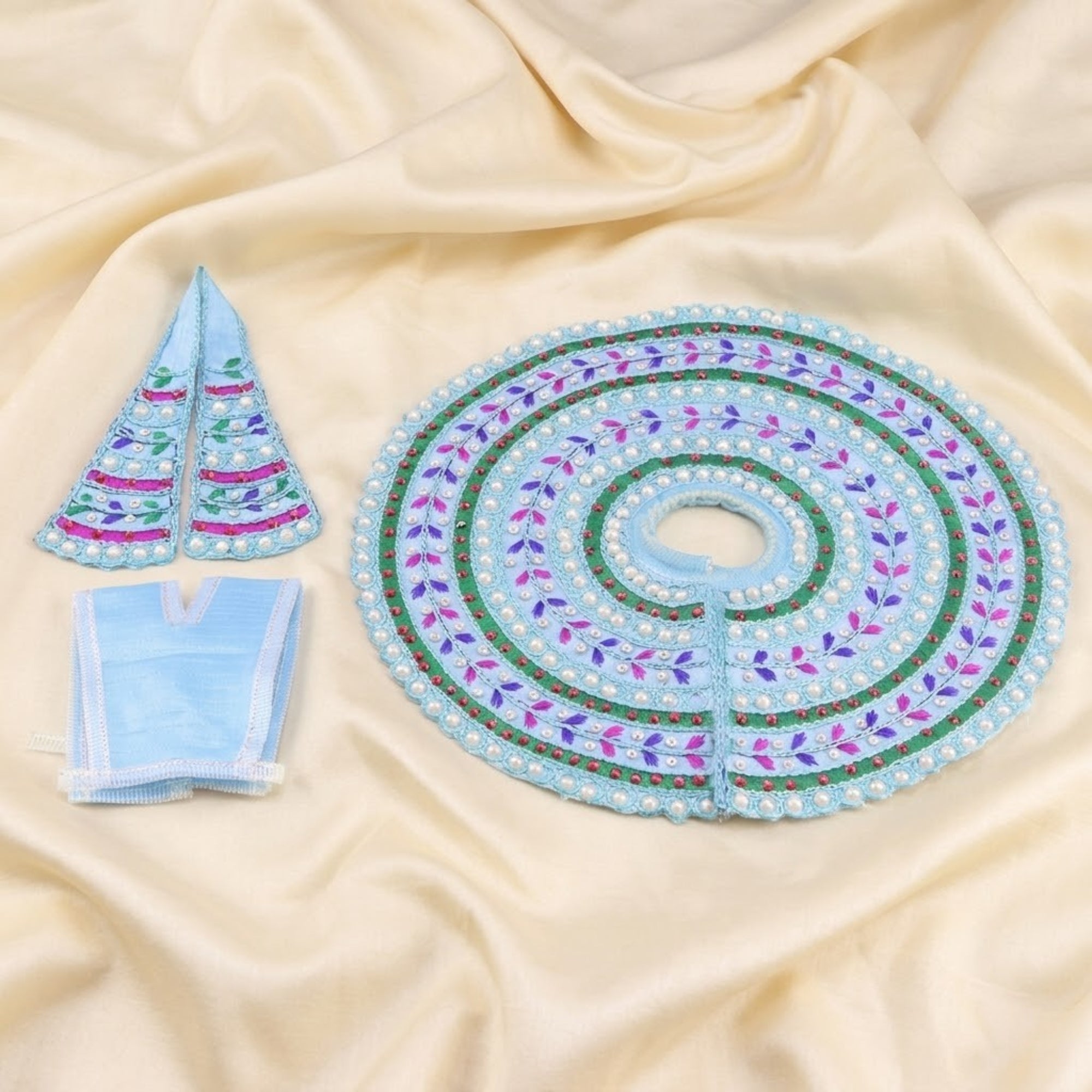 Handmade Laddu Gopal blue dress with Moti thread work and matching Patka displayed flat