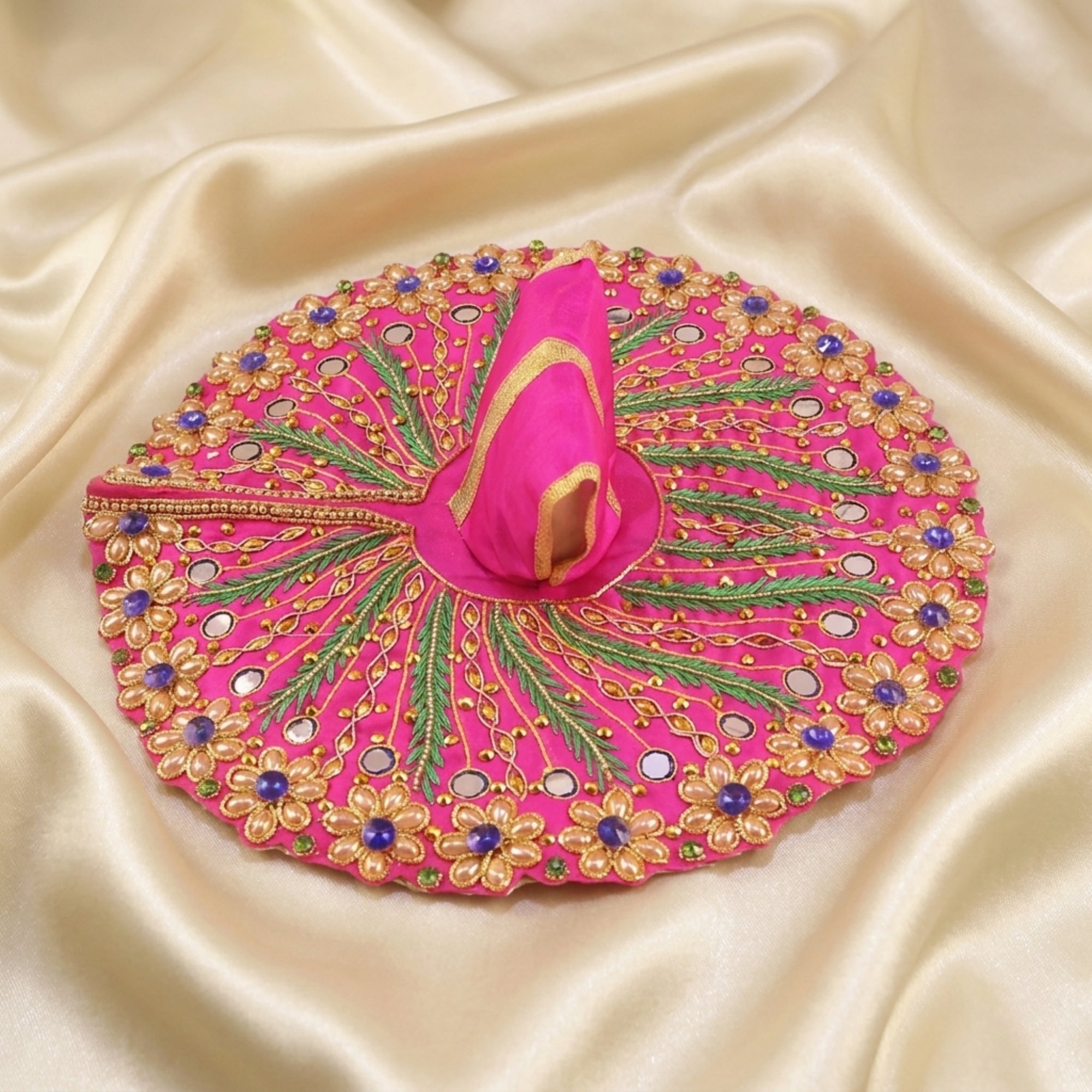 Laddu Gopal pink dress with handcrafted peacock design and mirror work displayed flat