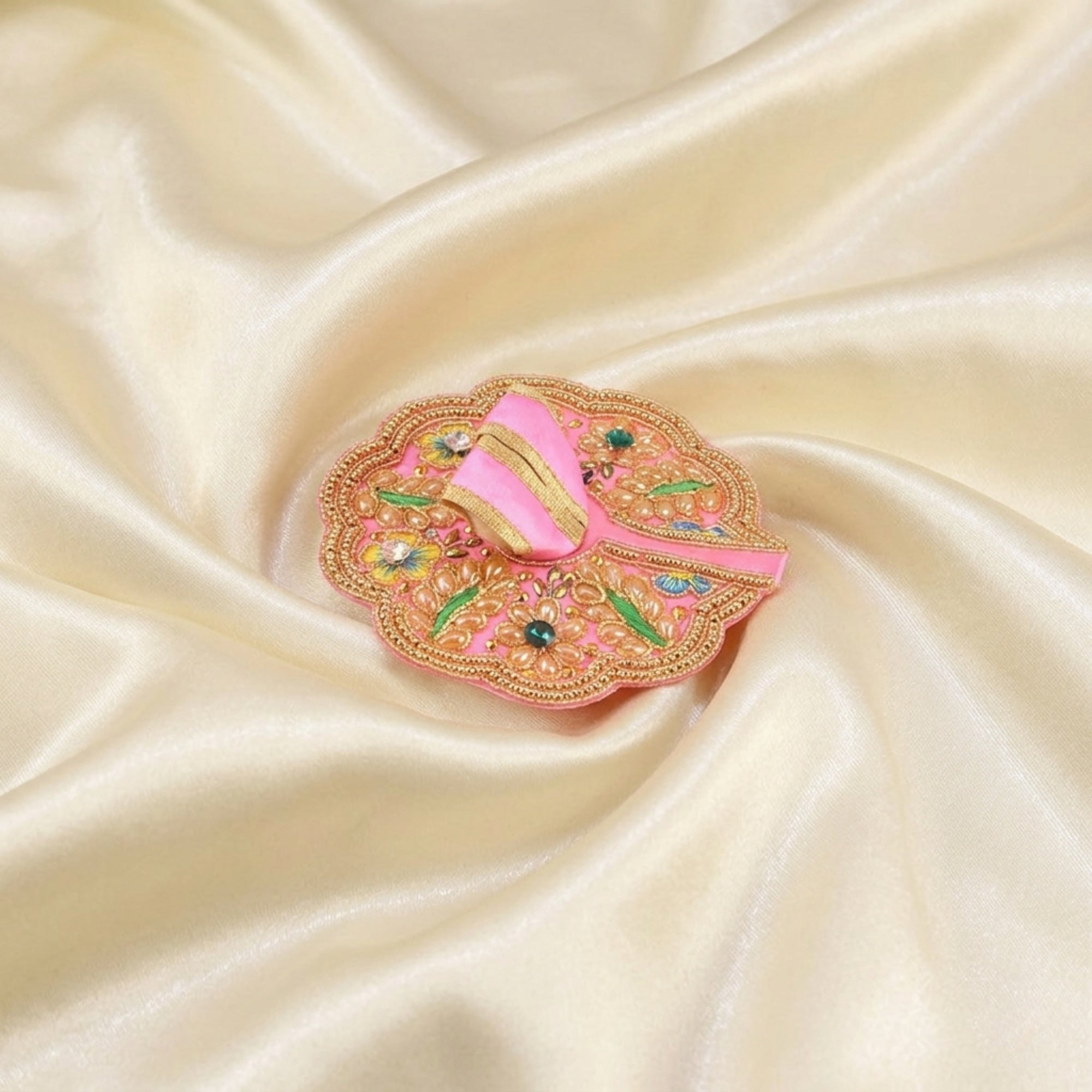 Laddu Gopal pink dress with handcrafted peacock design displayed flat