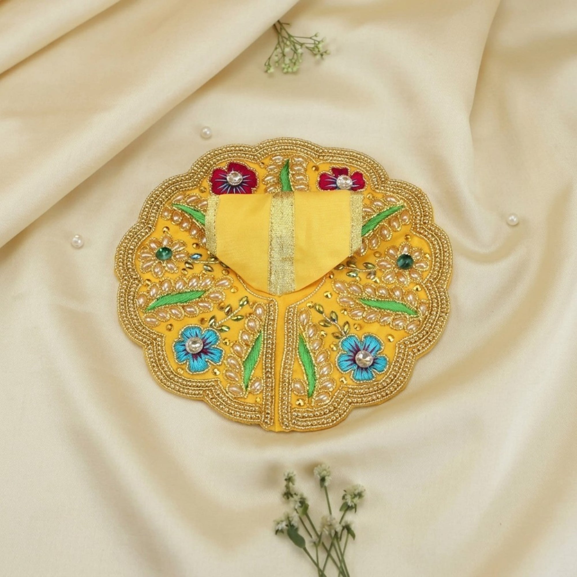 Handmade Laddu Gopal yellow dress with floral and leaf design poshak displayed flat
