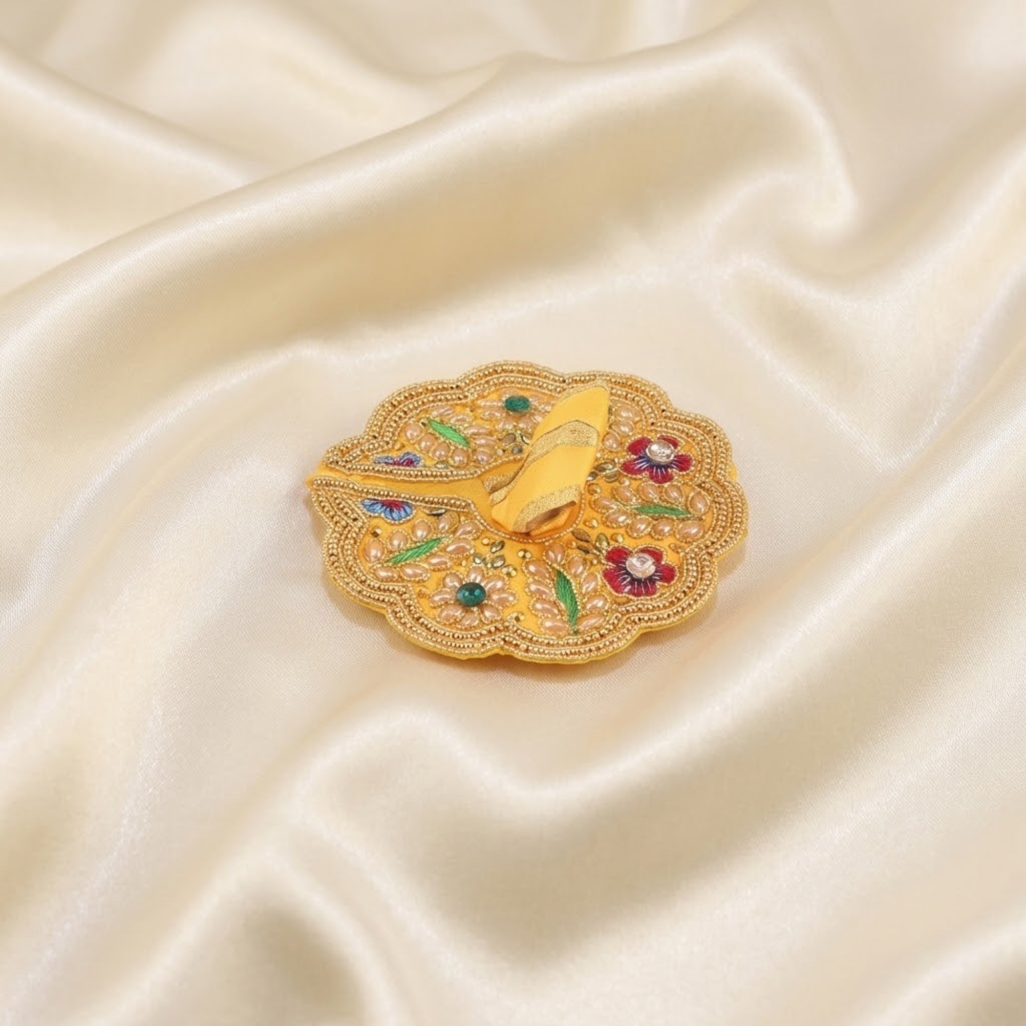 Laddu Gopal yellow dress with handcrafted floral work peacock design displayed flat