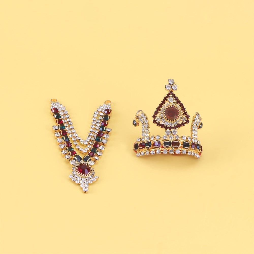 Laddu Gopal stone studded V-shaped mala and mukut crown jewellery set on yellow background