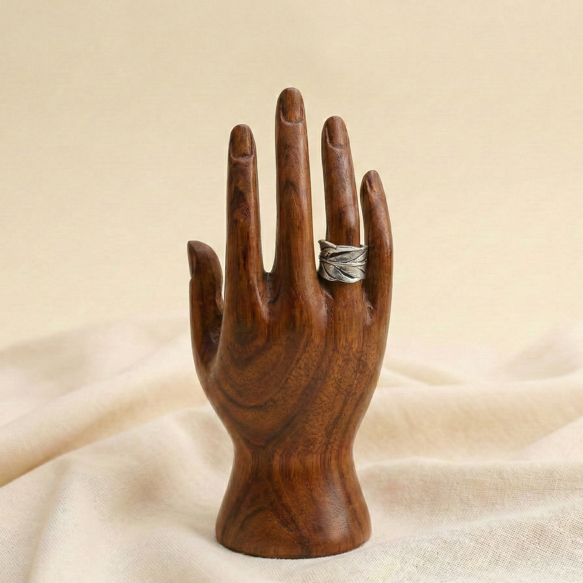 Leaf design oxidized metal adjustable ring displayed on a wooden hand stand