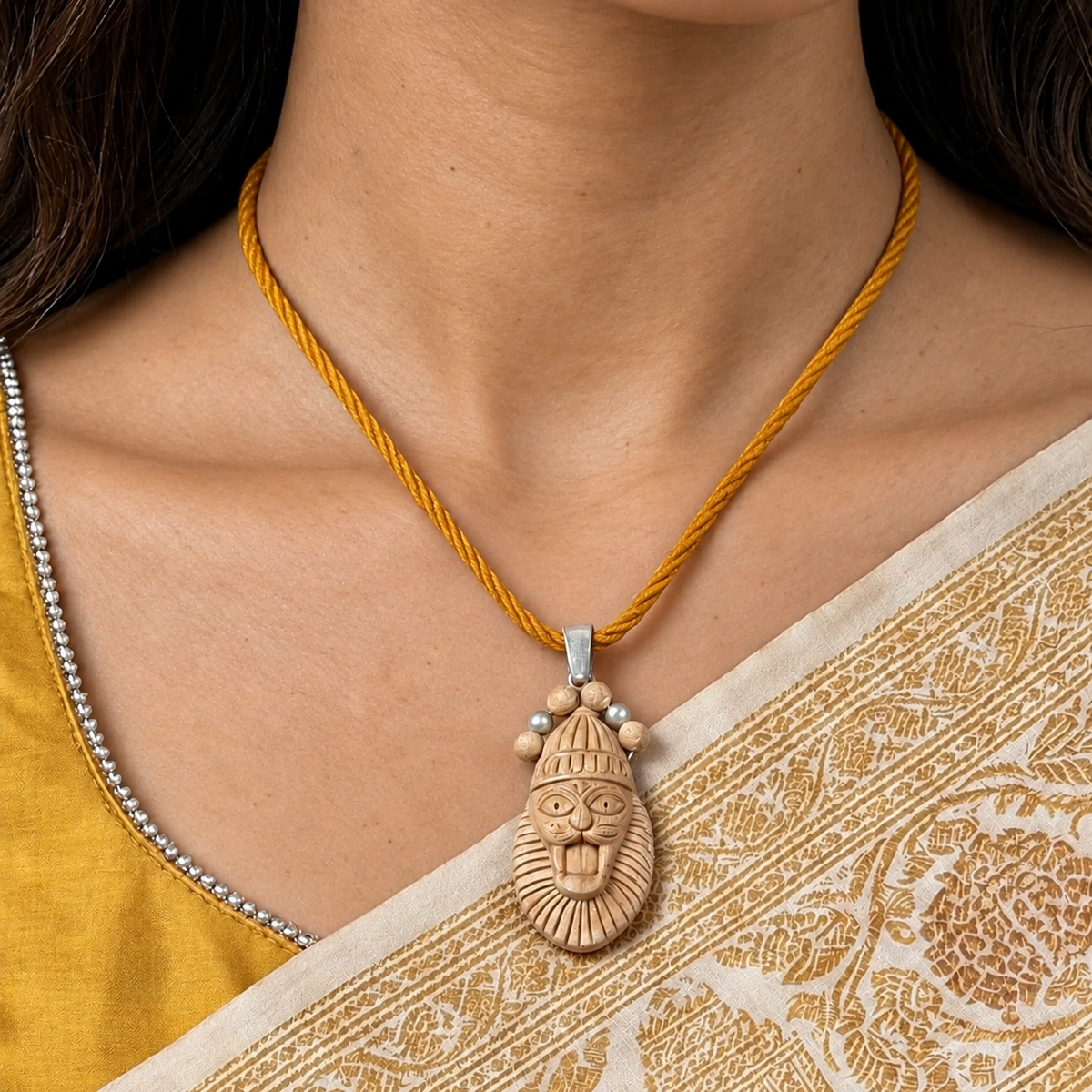 Carved narasimha avatar Tulsi wood pendant on a yellow thread necklace 