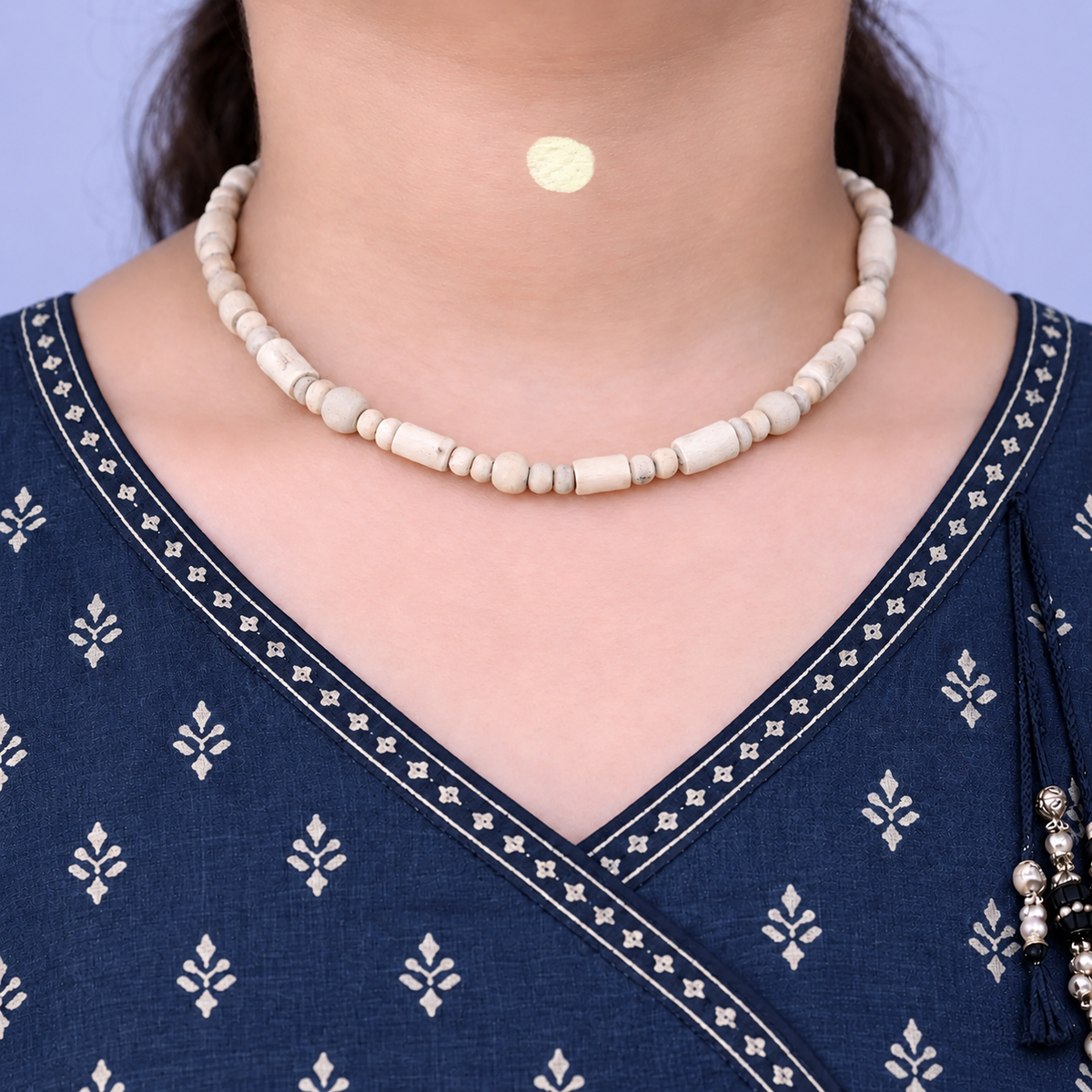 Woman wearing natural Tulsi Mala with original 4 mm and 6 mm Tulsi beads, 18 inch length
