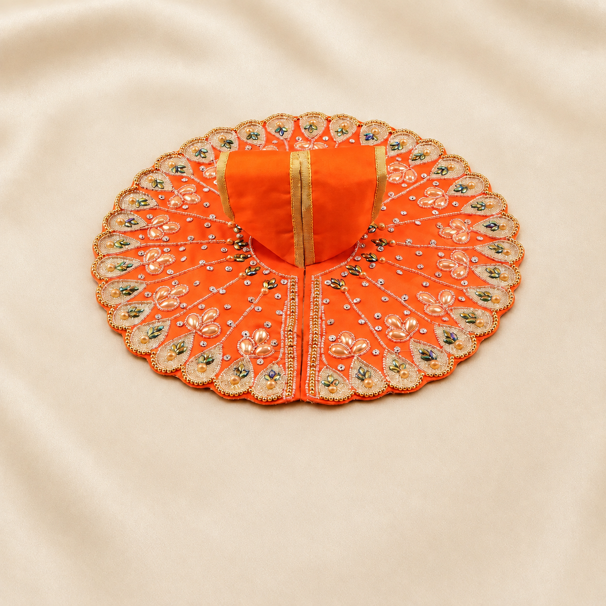 Orange Laddu Gopal dress with golden floral border and pearl grid detailing.