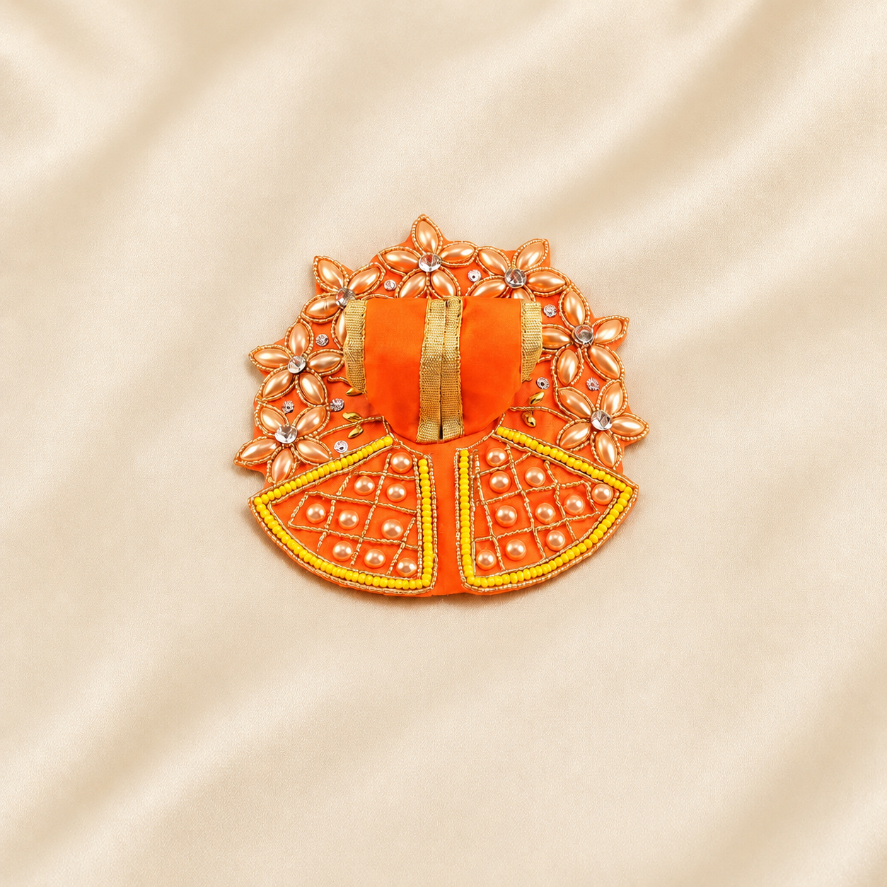 Orange Laddu Gopal dress with golden floral border and pearl grid detailing.