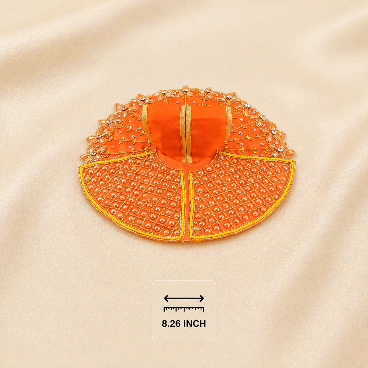Orange Laddu Gopal dress with pearl lattice panels, floral border and golden embroidery