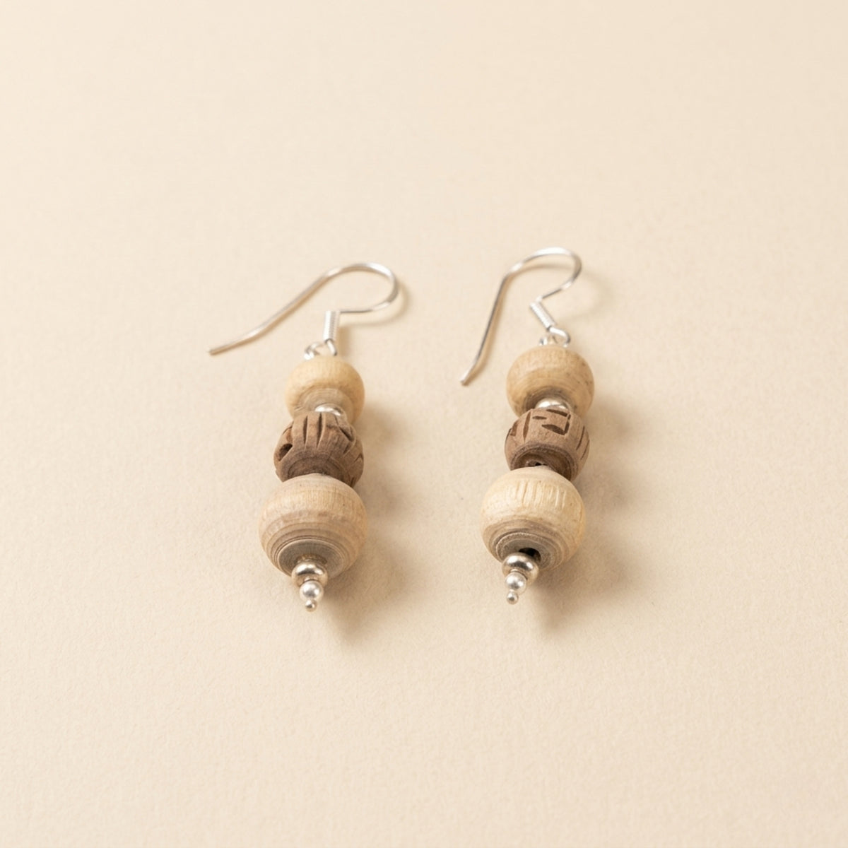 original silver dangle earrings featuring authentic Tulsi wood beads