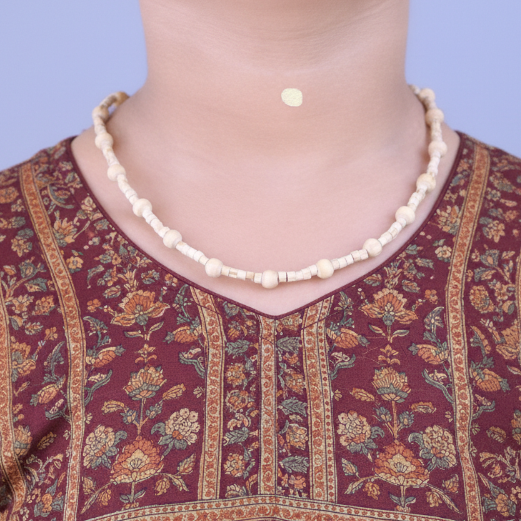 Woman wearing an original Tulsi kanthi mala around her neck for spiritual protection