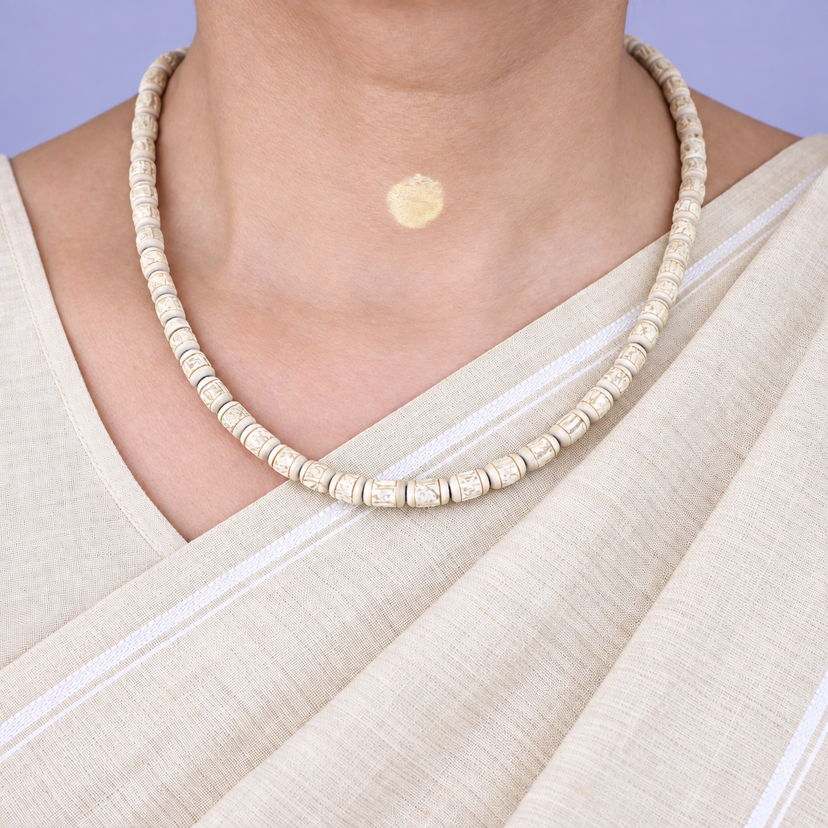 Woman wearing original Tulsi Mala made with natural handmade Tulsi beads in a traditional necklace style.
