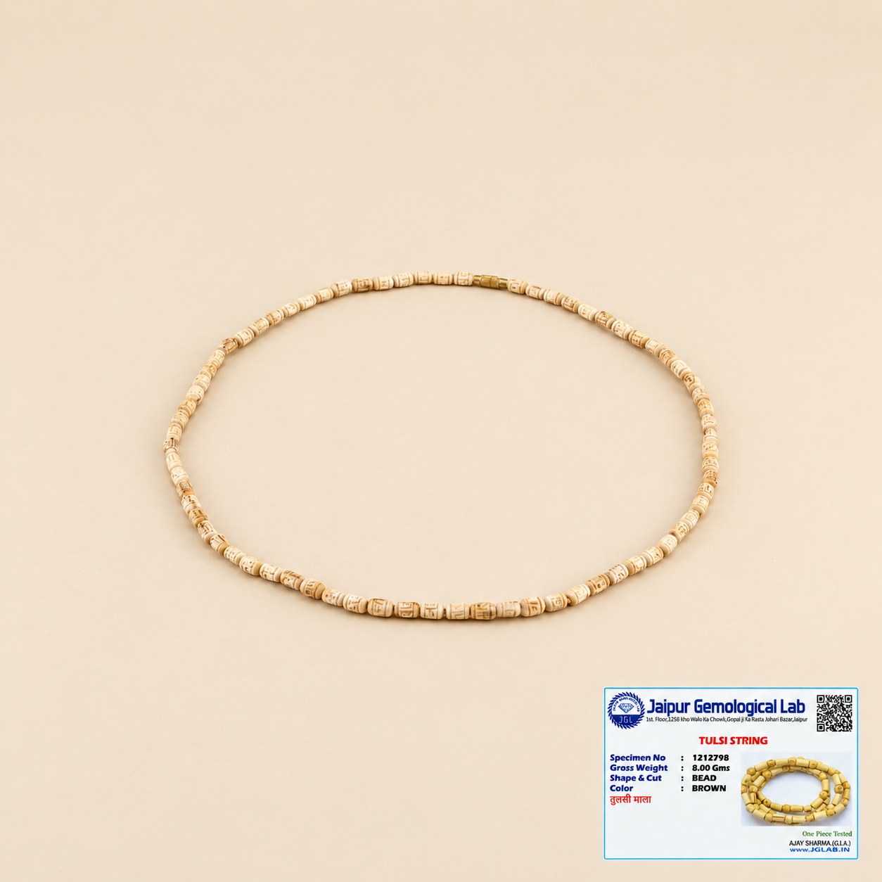 Original Tulsi Mala with natural carved Tulsi beads displayed with certification 