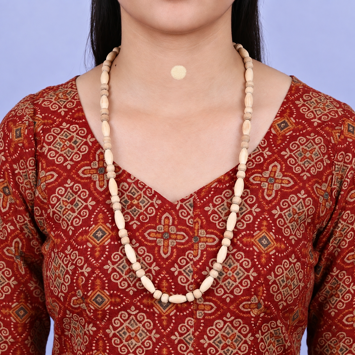Woman wearing an original tulsi mala with natural pure tulsi beads in a 24 inch necklace style