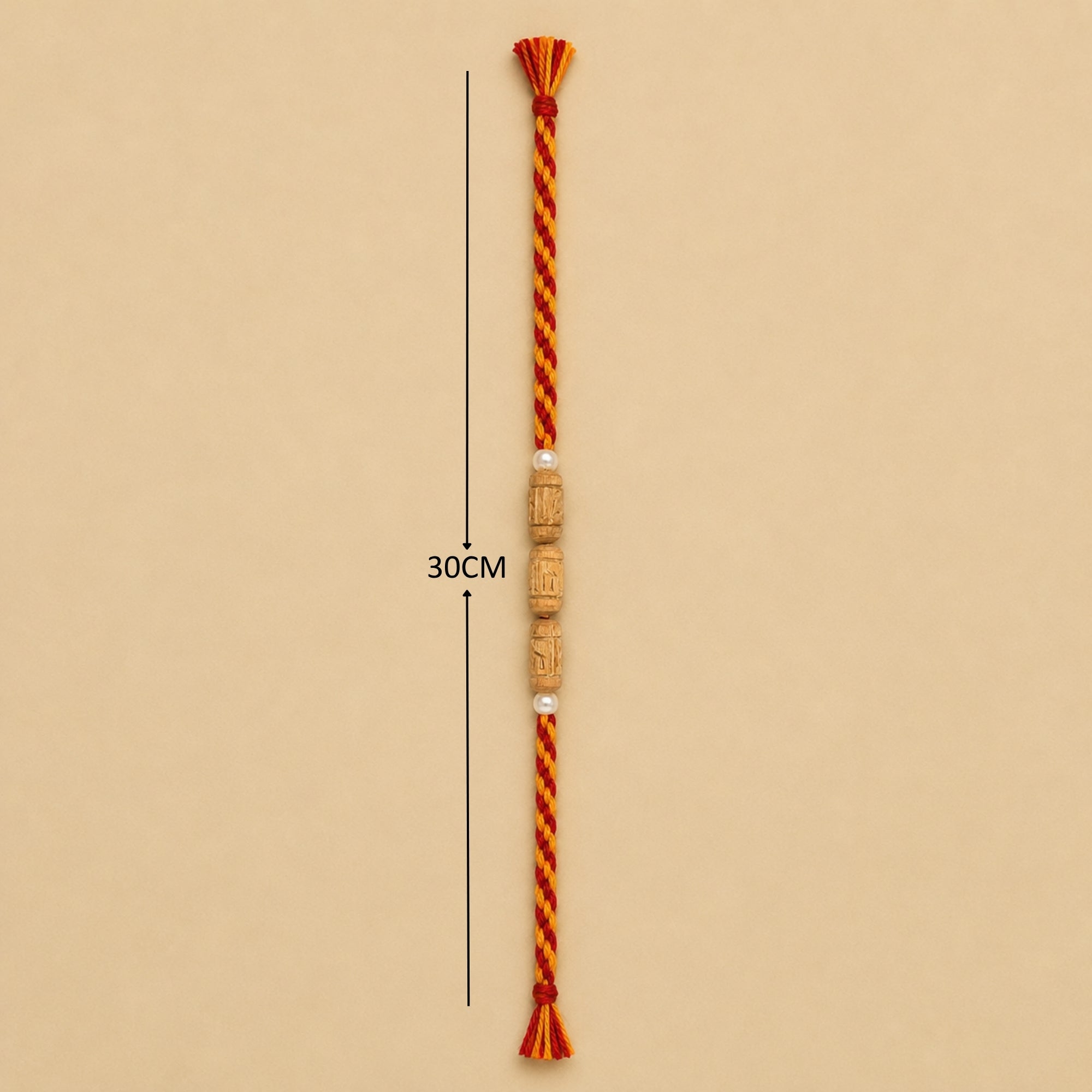  30 cm length for the handcrafted original Tulsi wood beaded Rakhi with red and yellow braided thread.