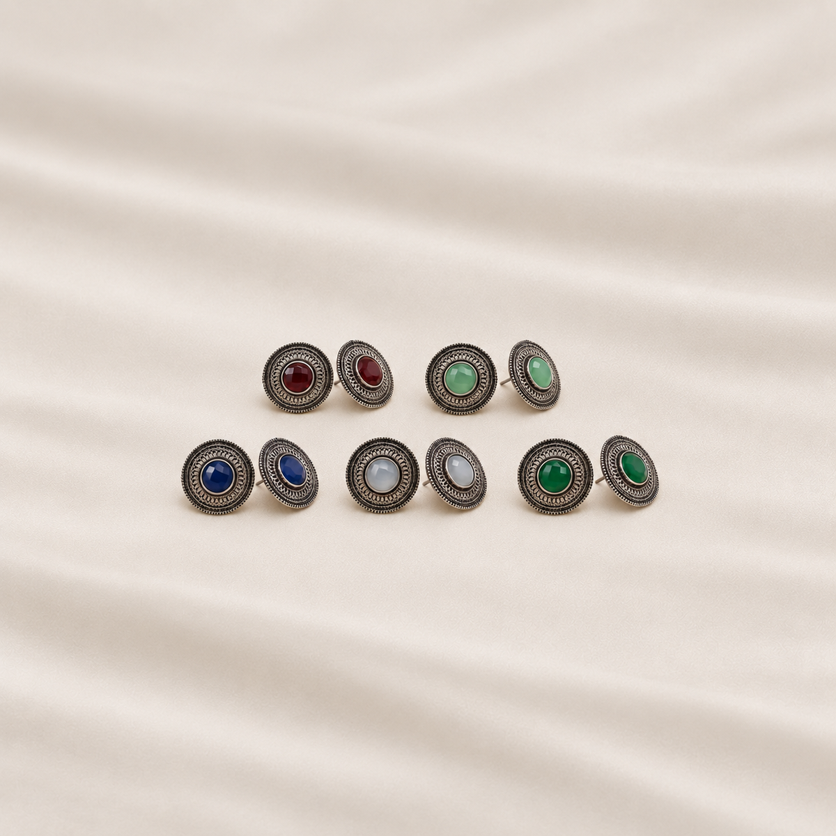 Multicolor oxidized metal stud earrings set with red, green, blue and white stone centres