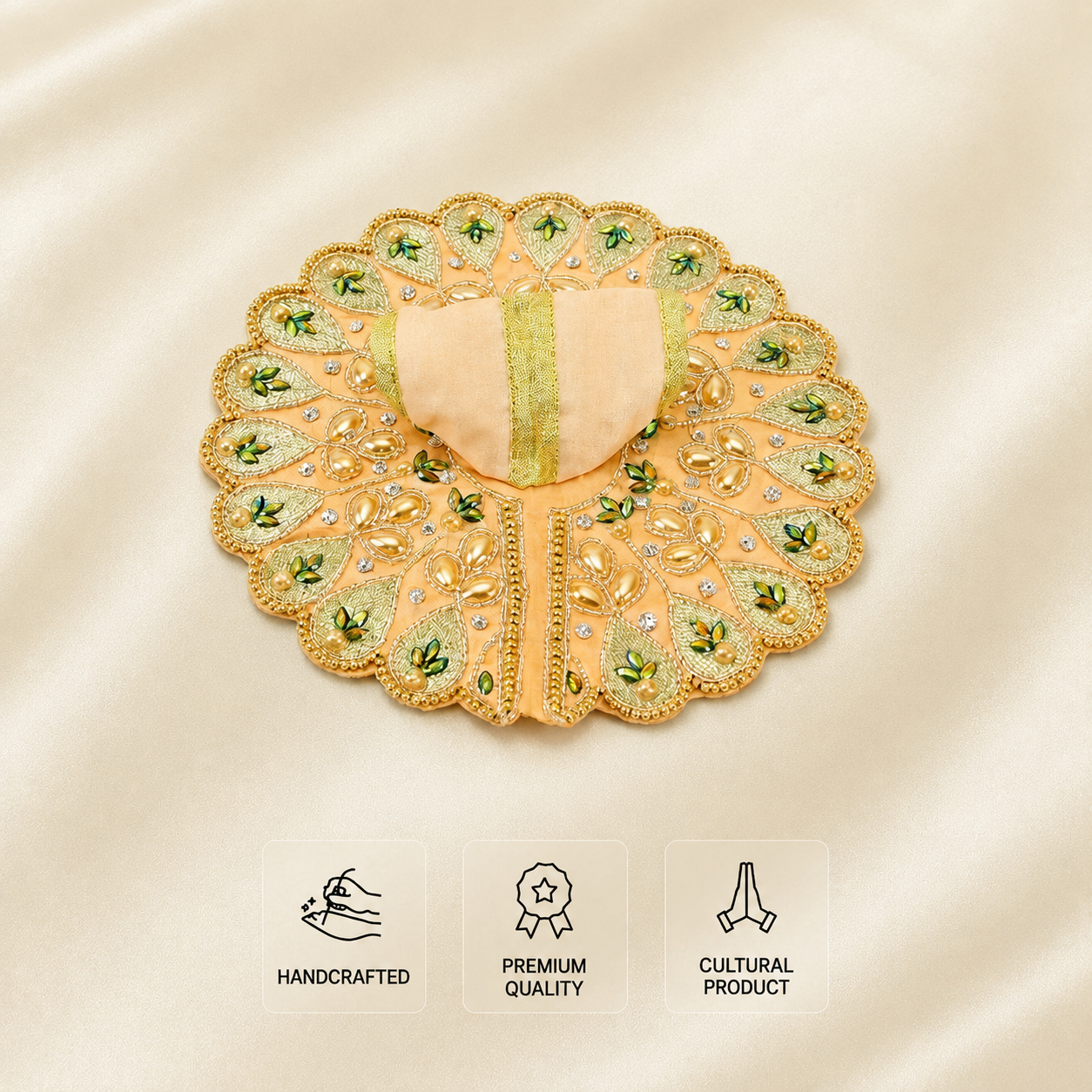 Peach handcrafted Laddu Gopal dress with pearl embroidery, green leaf motifs and gold beaded border