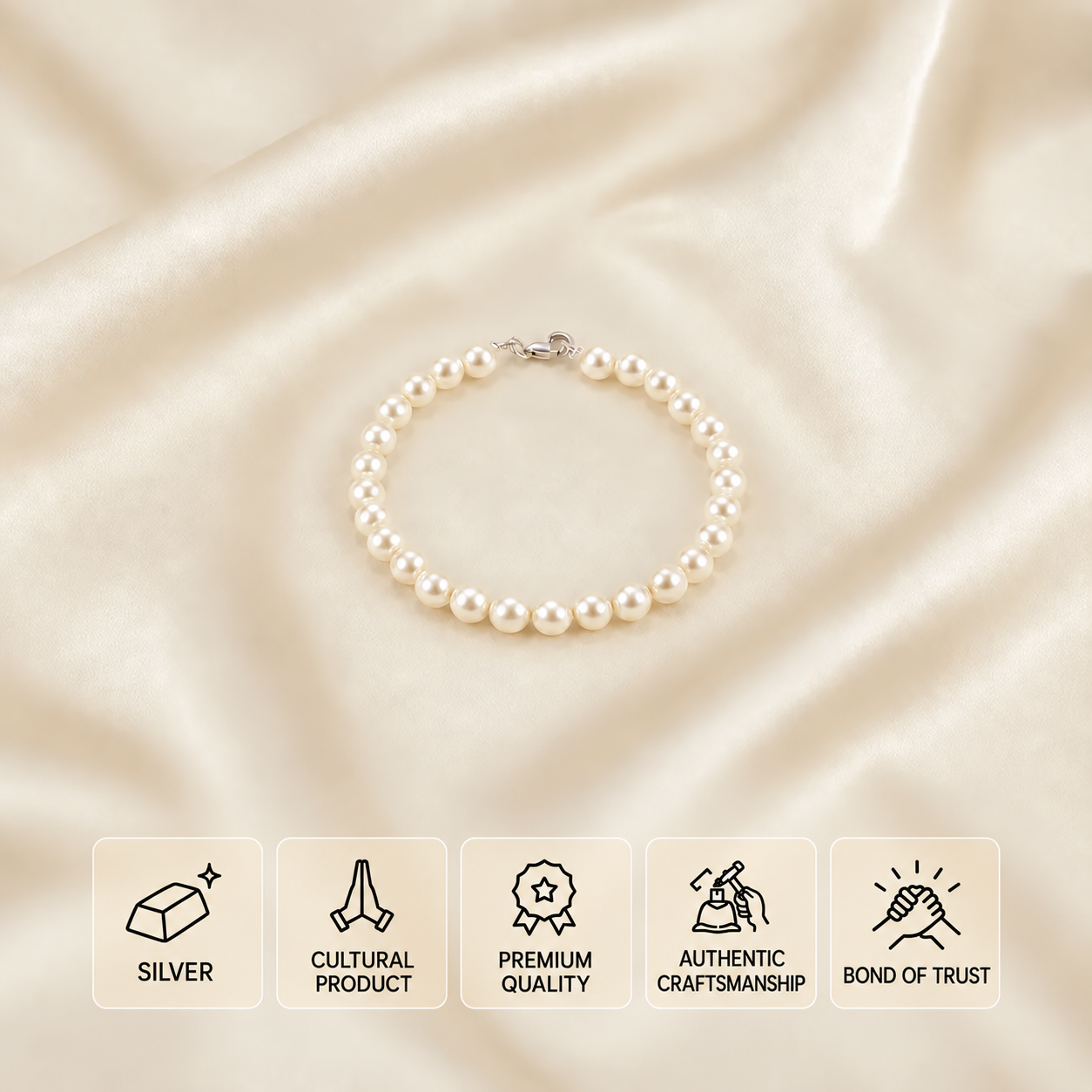Pearl bead bracelet with ornate silver hook around the centre bead on cream satin, with five feature cards.