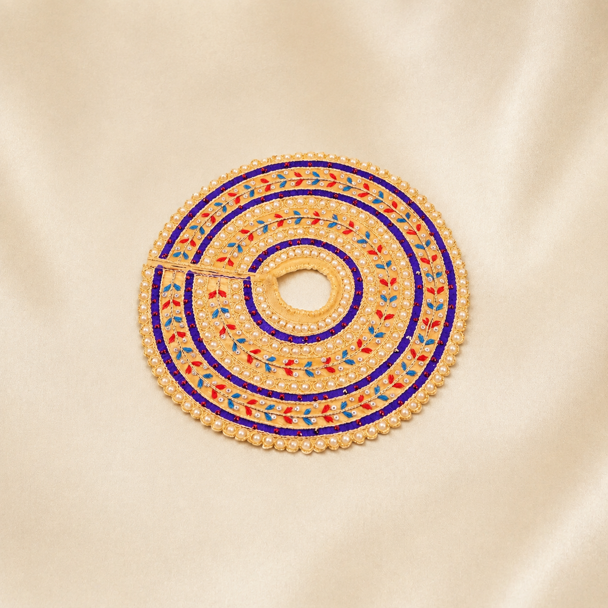 Beige Laddu Gopal dress with purple border, pearl work and colourful leaf embroidery