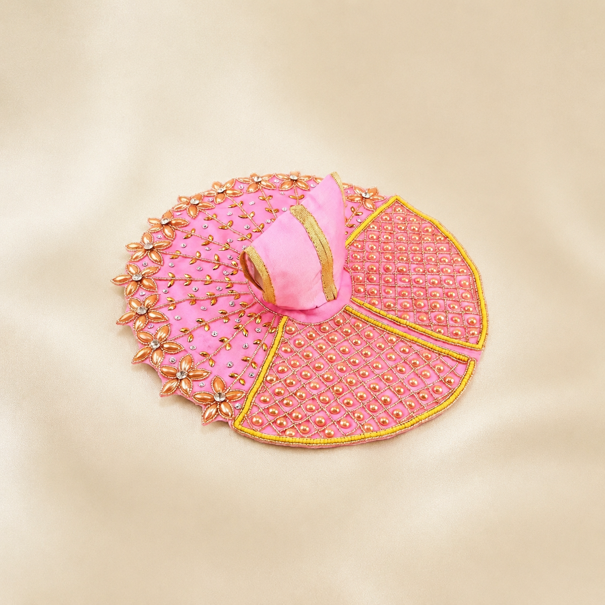 Pink Laddu Gopal dress with pearl lattice panels, peach floral border, gold leaf embroidery and matching garment