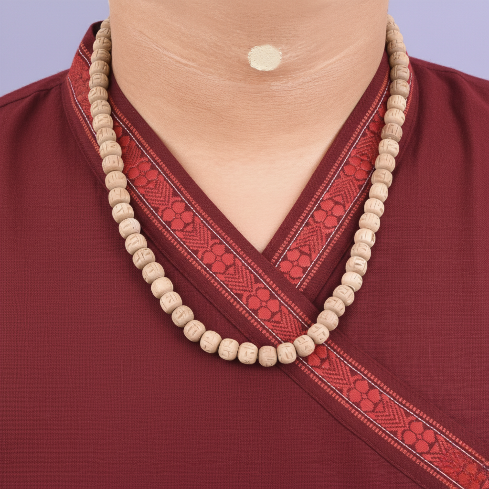 Woman wearing a premium Tulsi kanthi mala featuring large 10mm carved round beads