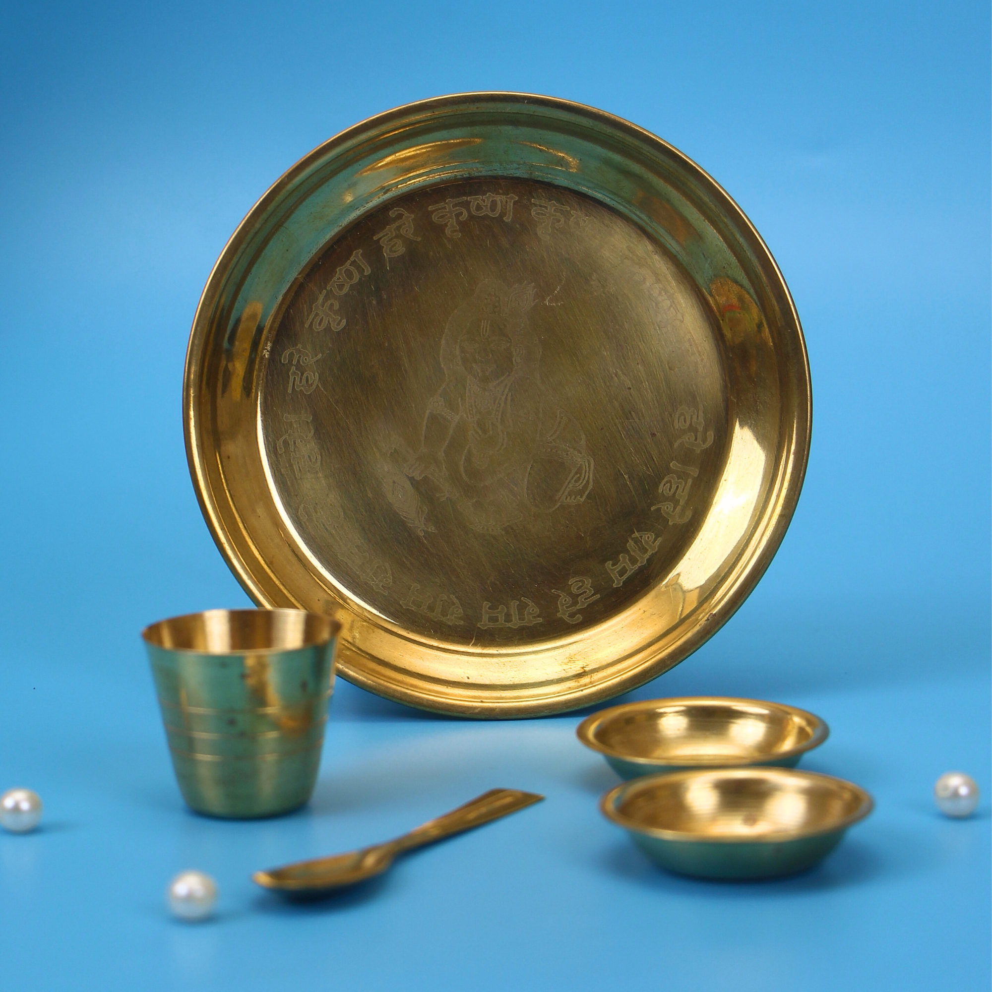 Pure brass bhog utensils set with puja thali and bowls displayed flat