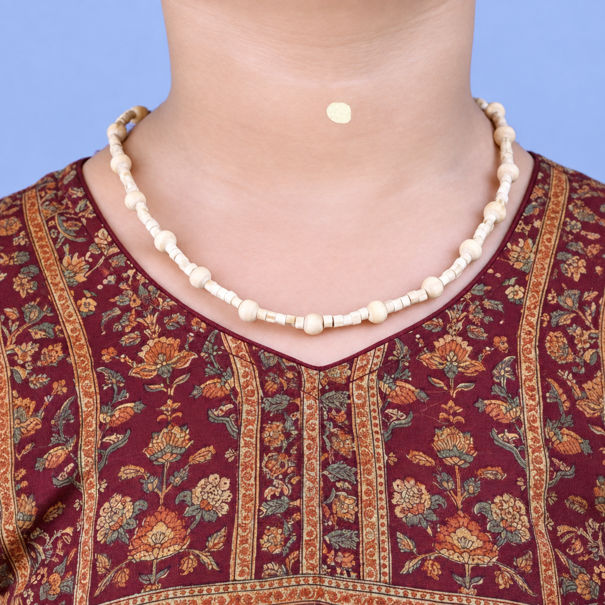 Woman wearing an original Tulsi kanthi mala around her neck for spiritual protection