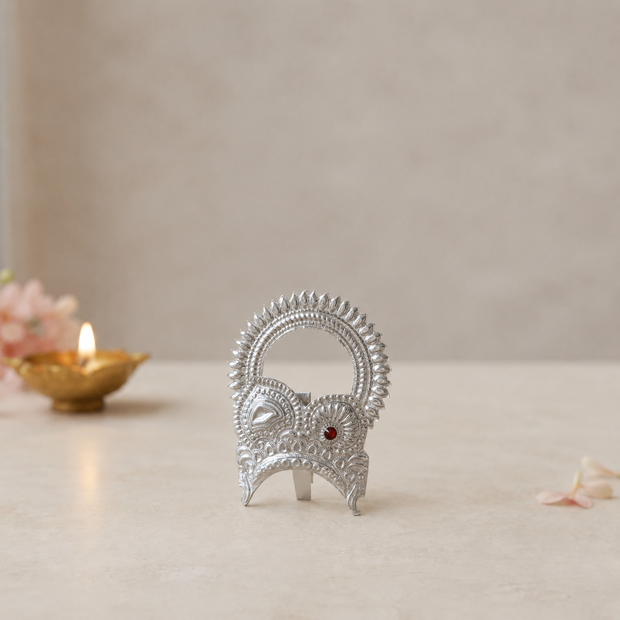 Pure 925 silver traditional carved mukut for Laddu Gopal displayed with brass diya