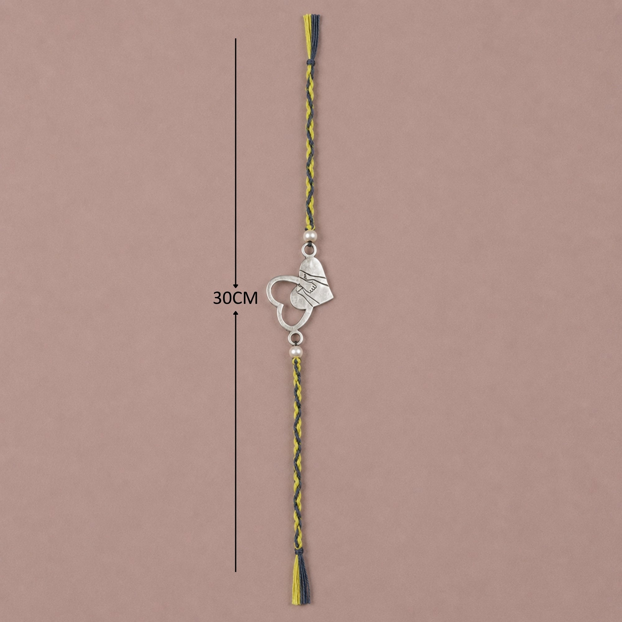 Full length view showing thread layout and dimensions of pure silver dual heart rakhi