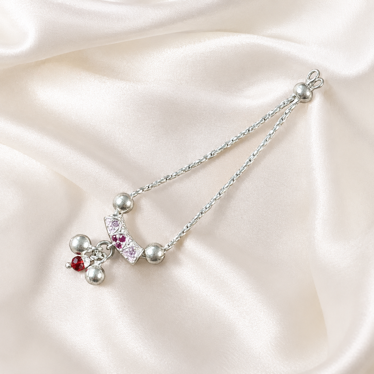 Pure silver necklace for Kanha Ji with pink stones and pearl drops on cream silk fabric