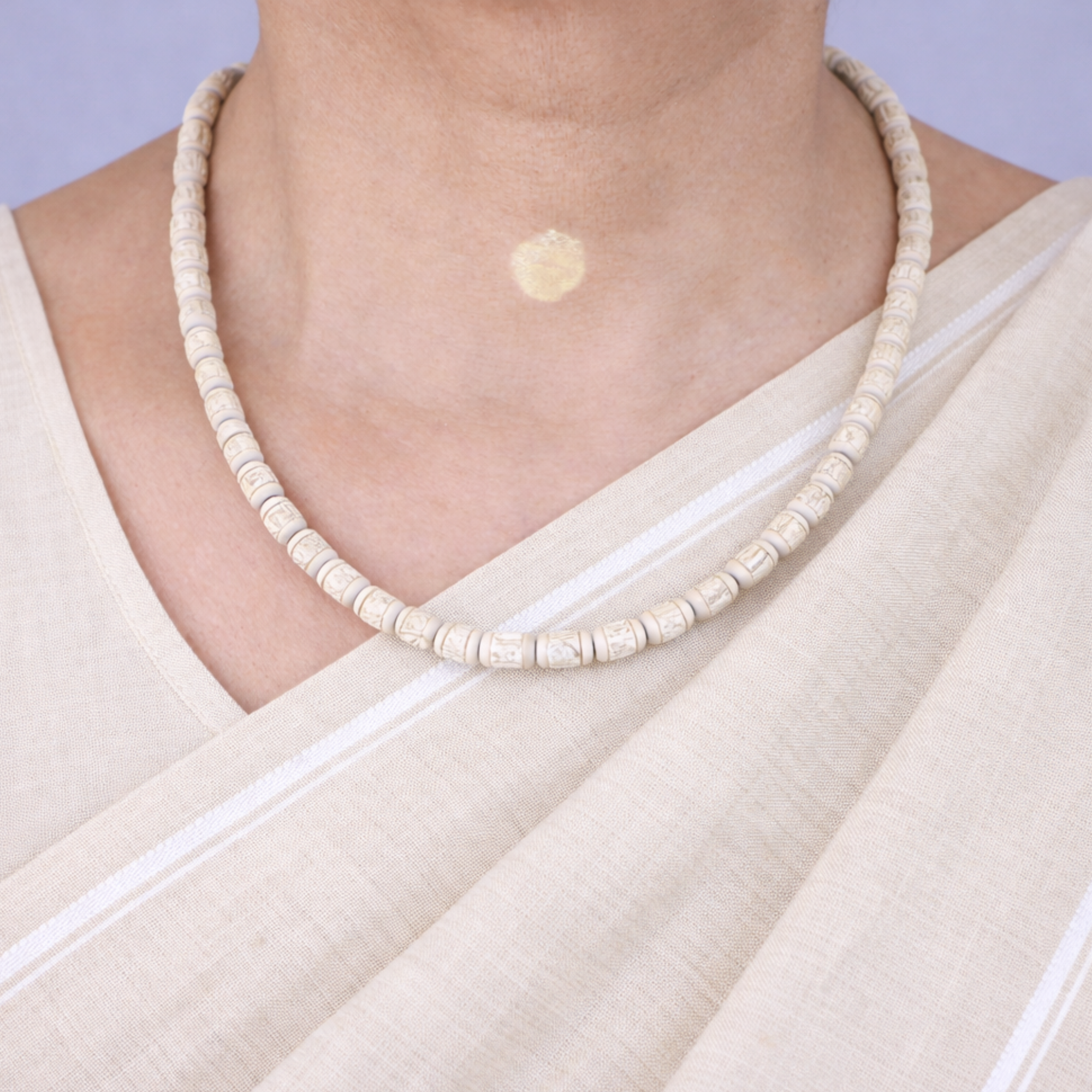 Woman wearing a pure Tulsi kanthi mala with Radha name carved cylindrical beads